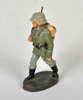 GERMAN WWII ELASTOLIN MARCHING SOLDIER.