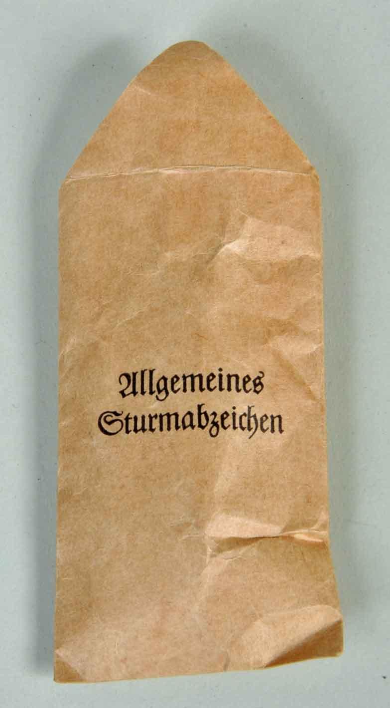 GERMAN WWII GENERAL ASSAULT BADGE IN SILVER IN ORIGINAL PACKET.