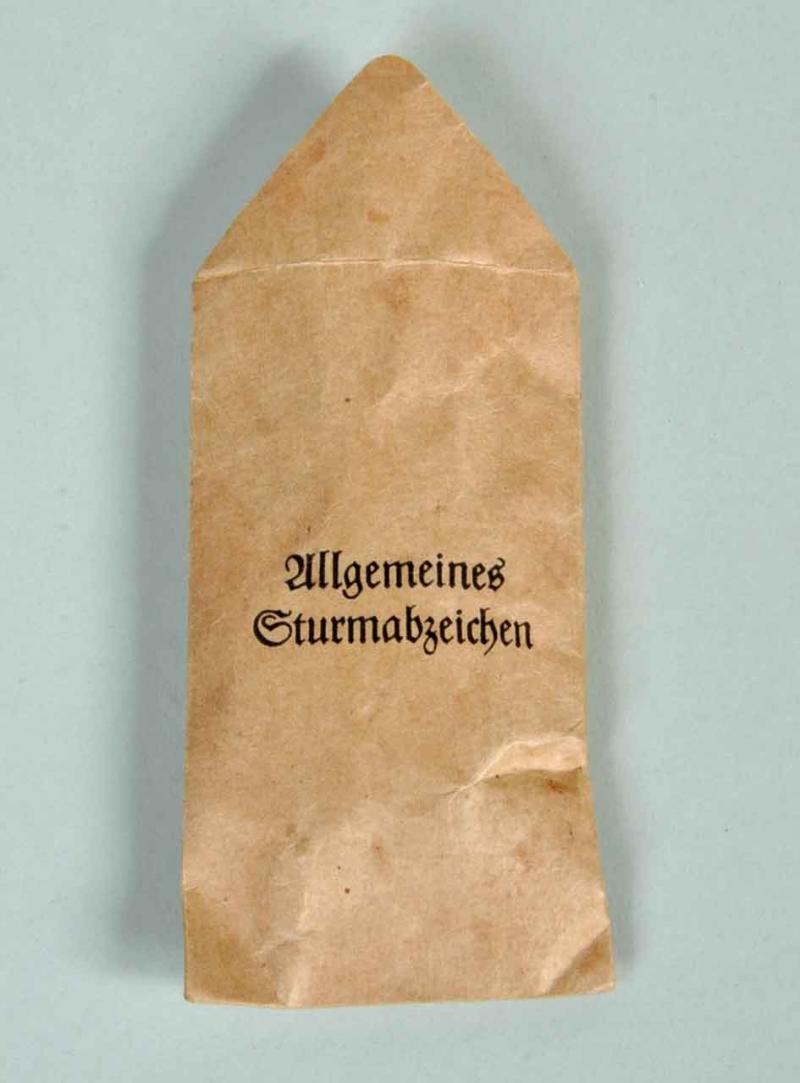 GERMAN WWII GENERAL ASSAULT BADGE IN SILVER IN ORIGINAL PACKET.