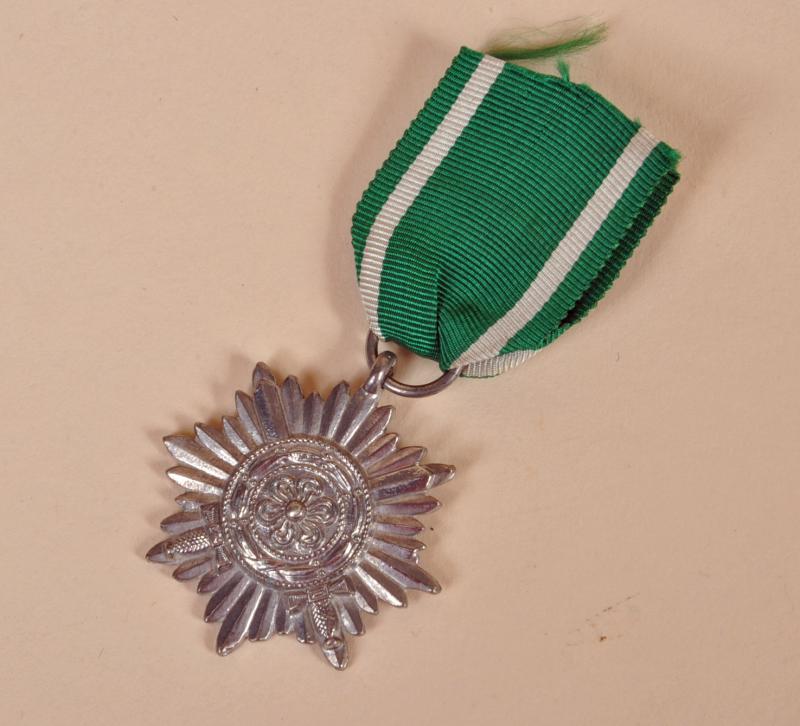 GERMAN WWII EASTERN PEOPLE’S AWARD IN SILVER WITH SWORDS.