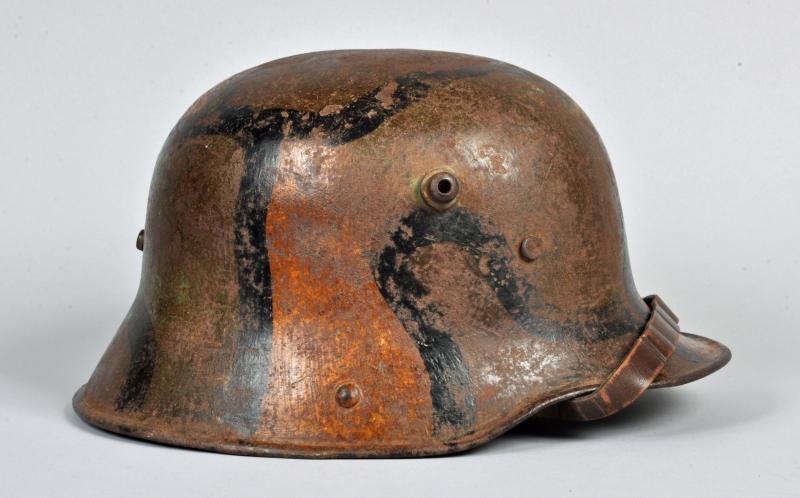 GERMAN WWI M.16 CAMOUFLAGE HELMET.