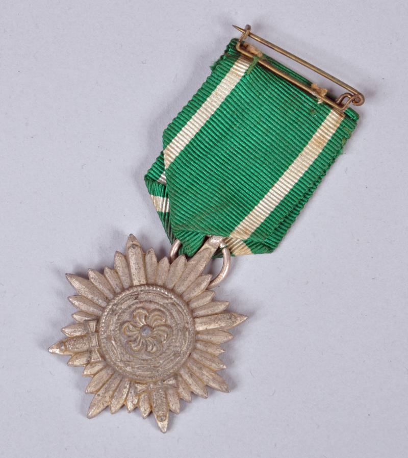 GERMAN WWII EASTERN PEOPLE’S AWARD 2ND CLASS IN SILVER WITH SWORDS.