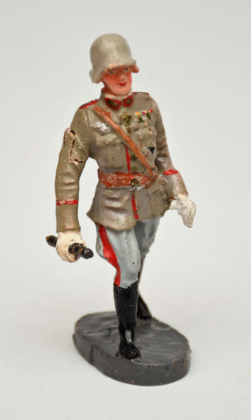 GERMAN WWII ELASTOLIN FIGURE OF MARCHING GENERAL.