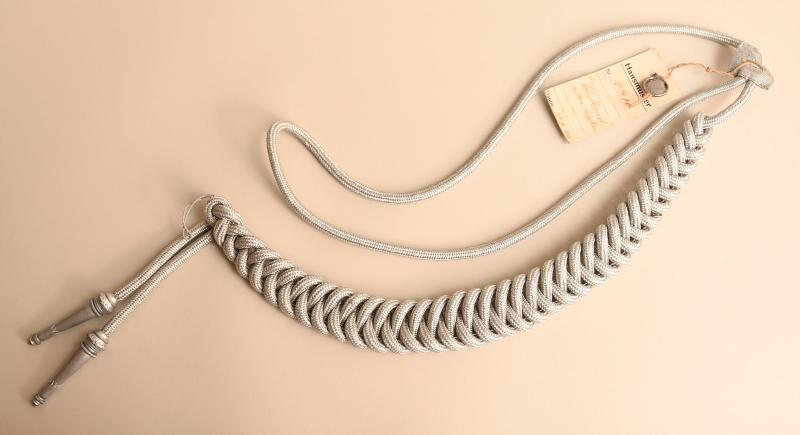 GERMAN WWII ARMY OFFICERS AIGUILETTES WITH HAUSMUSTER TAG.