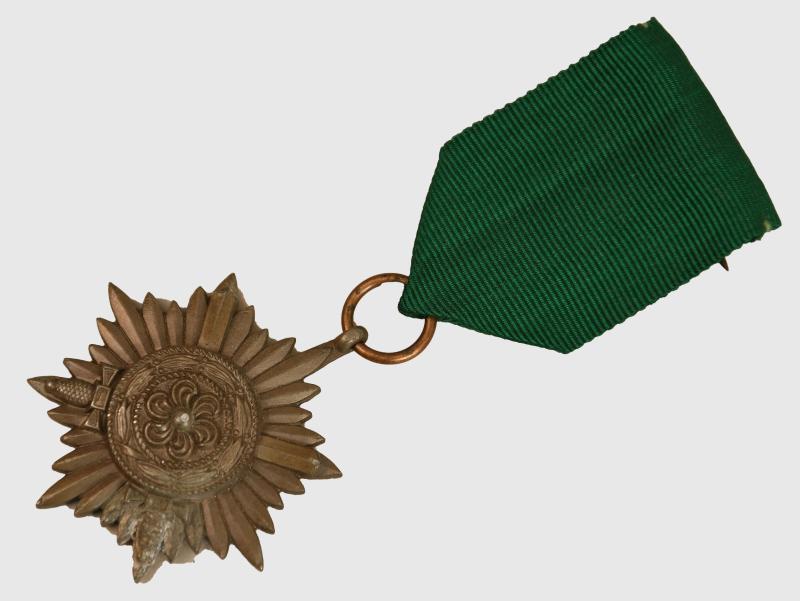 GERMAN WWII EASTERN PEOPLE’S MEDAL IN BRONZE WITH SWORDS 2ND CLASS.