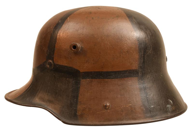 GERMAN WWI M16 CAMOUFLAGE TRENCH HELMET.