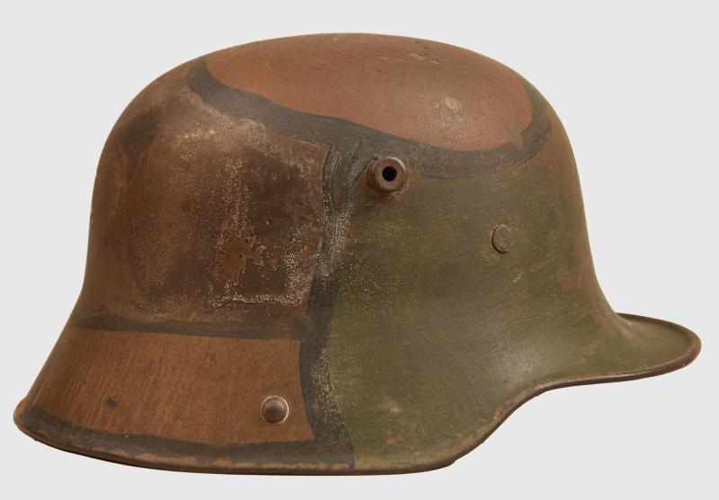 GERMAN WWI M.16 CAMOUFLAGE COMBAT HELMET, IDENTIFIED.