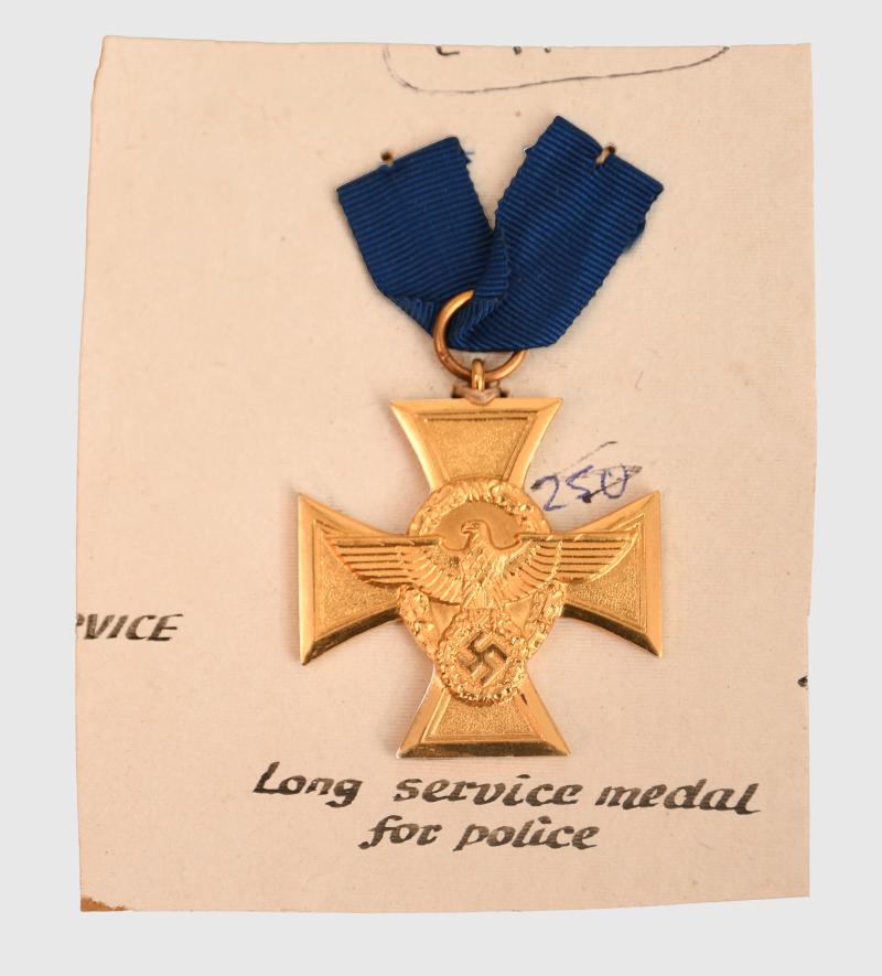 GERMAN WWII POLICE 18 YEAR LONG SERVICE MEDAL IN GILT ON CARD.