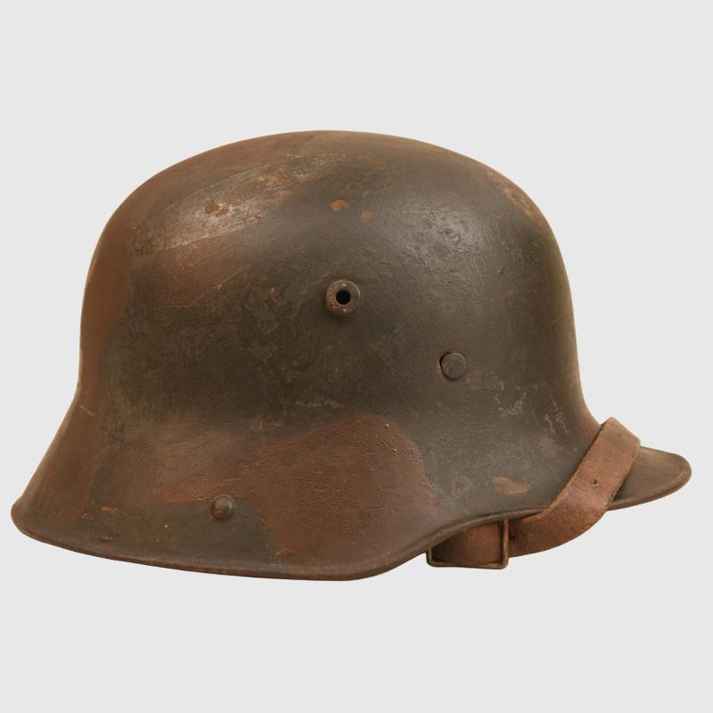 GERMAN WWI M.16 CAMOUFLAGE TRENCH HELMET.