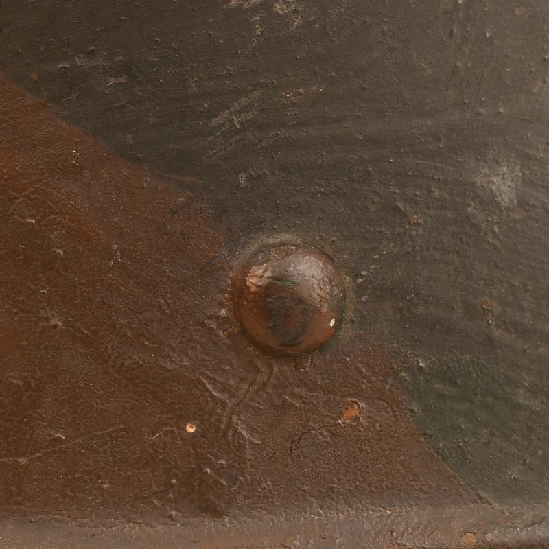 GERMAN WWI M.16 CAMOUFLAGE TRENCH HELMET.