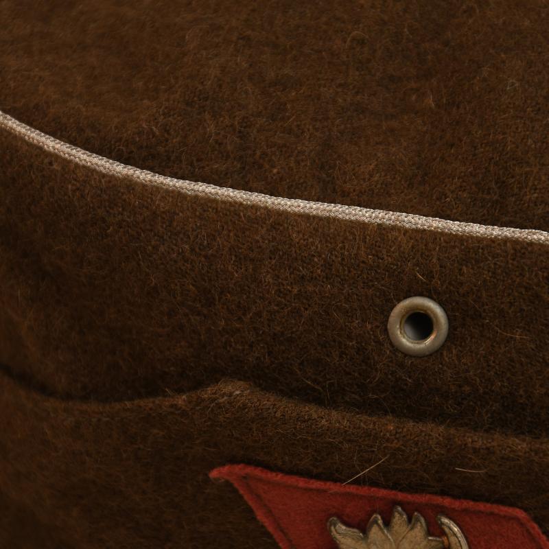 GERMAN WWII RMBO VISORED FIELD CAP.