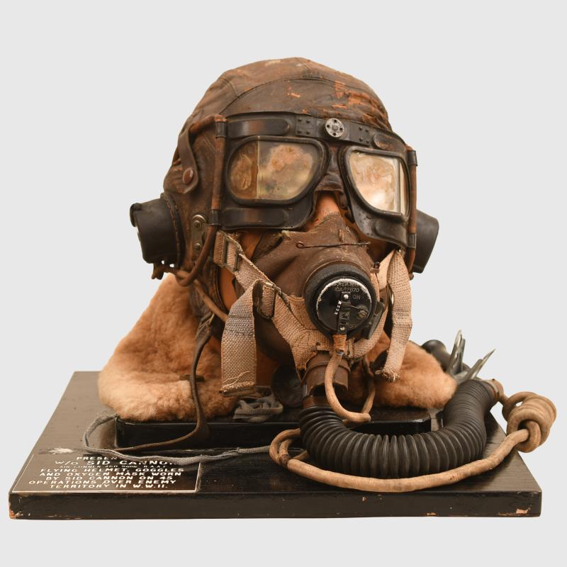 BRITISH WWII RAF FLYING HELMET, GOGGLES AND MASK IDENTIFIED.