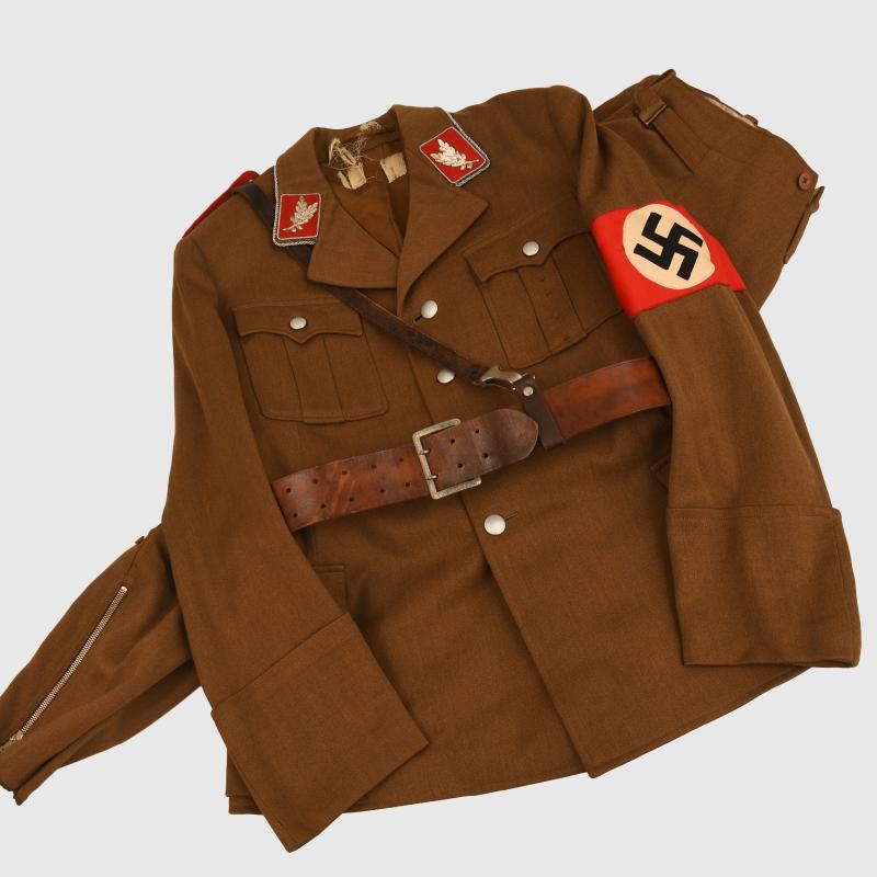 GERMAN WWII SA STANDARTENFUHRER’S TUNIC, BREECHES AND BELT.