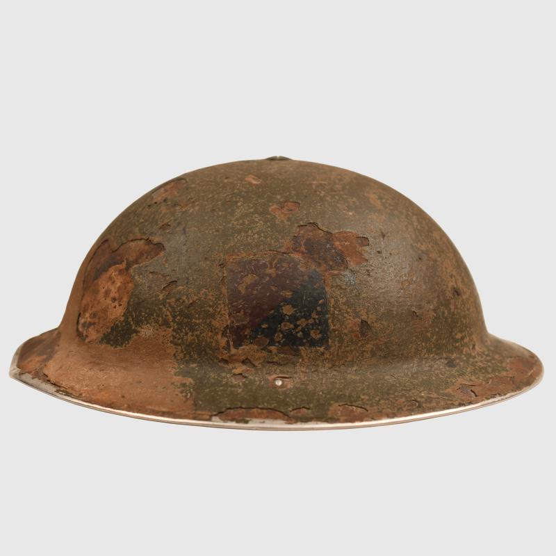BRITISH WWII 9TH ROYAL FUSILIERS ITALIAN CAMPAIGN BATTLE DAMAGED BRODIE HELMET.