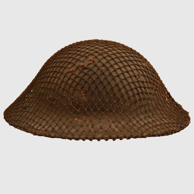 BRITISH 1940 DATED BRODIE HELMET WITH NET COVER.