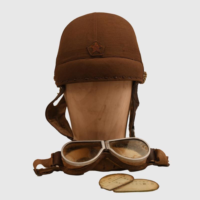 JAPANESE WWII TANKERS HELMET WITH EXTREMELY RARE GOGGLES AND SPARE LENSES.