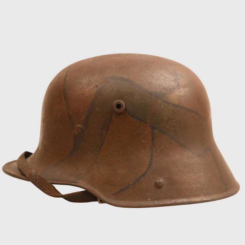GERMAN WWI M.17 CAMOUFLAGE TRENCH HELMET WITH ORIGINAL CHINSTRAP AND LINER.