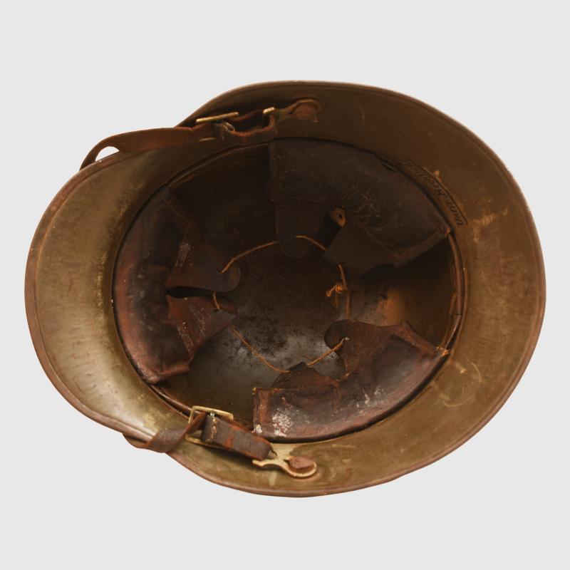 GERMAN WWI M.17 CAMOUFLAGE TRENCH HELMET WITH ORIGINAL CHINSTRAP AND LINER.