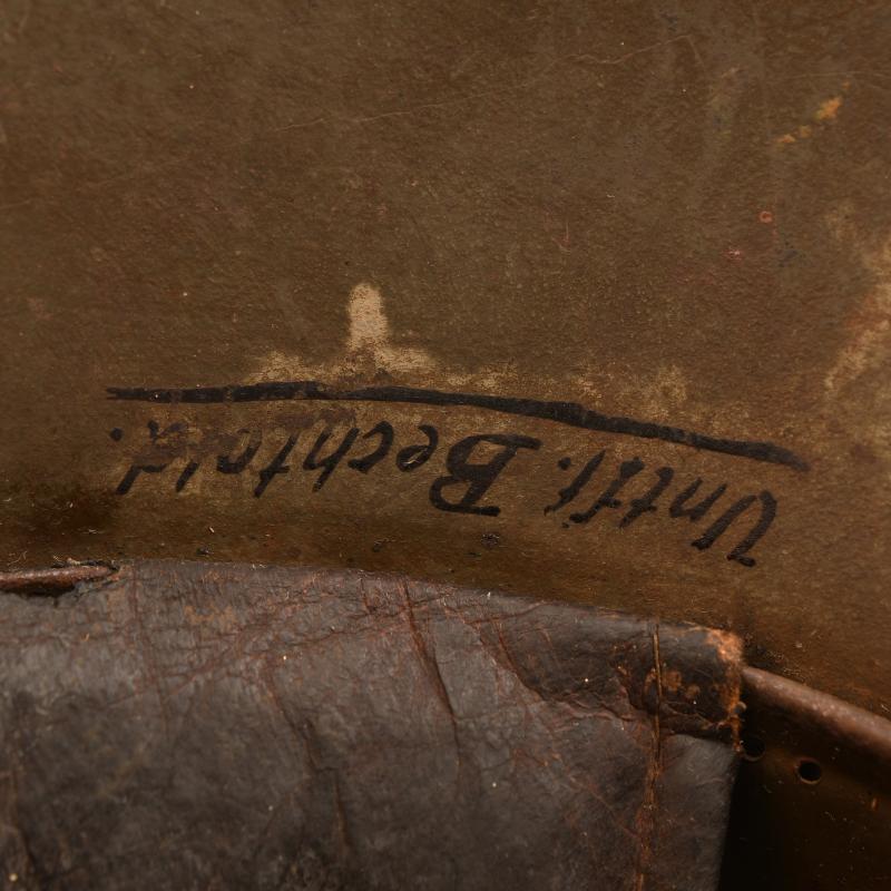 GERMAN WWI M.17 CAMOUFLAGE TRENCH HELMET WITH ORIGINAL CHINSTRAP AND LINER.
