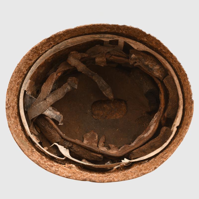 GERMAN WWII GROUND DUG PARATROOPER HELMET SHELL AND PARTIAL LINER.