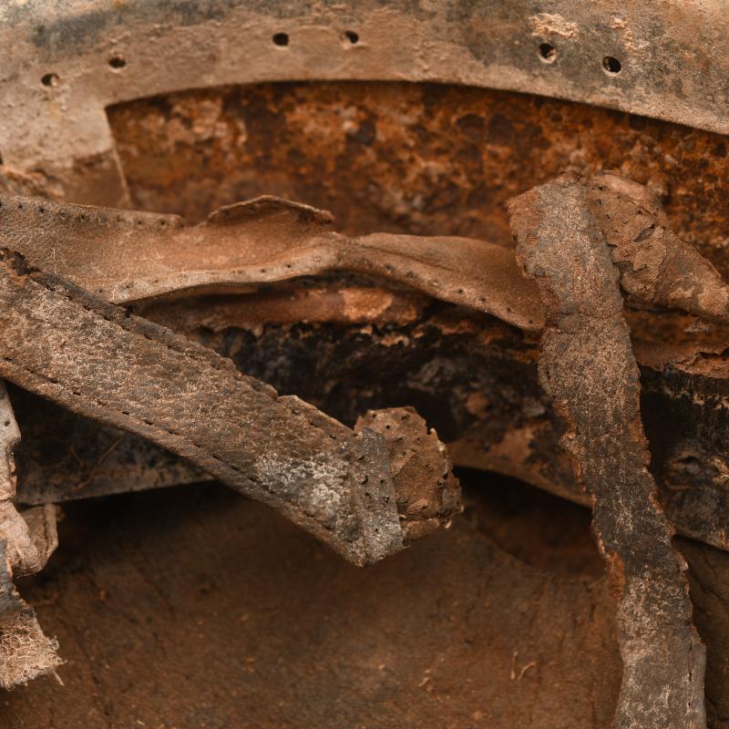 GERMAN WWII GROUND DUG PARATROOPER HELMET SHELL AND PARTIAL LINER.