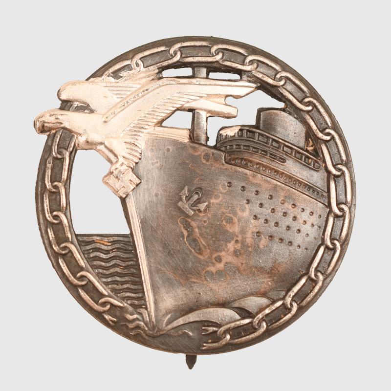 GERMAN WWII KRIEGSMARINE BLOCKADE BREAKER BADGE AND MINIATURE CASED.