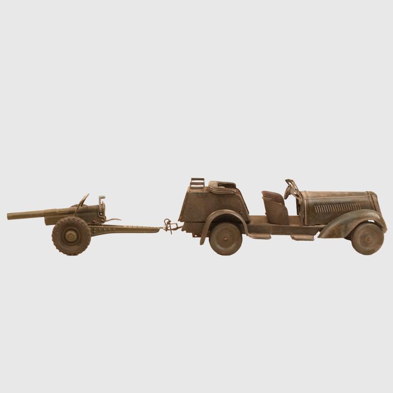 GERMAN WWII TIPCO PERSONAL CARRIER WITH ATTACHED LIGHT ANTI AIRCRAFT GUN TOY.