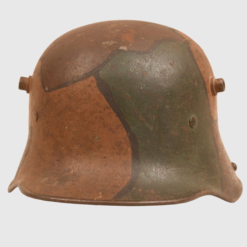 GERMAN WWI M.17 CAMOUFLAGE HELMET, COMPLETE WITH LINER AND THE RARE CHINSTRAP.