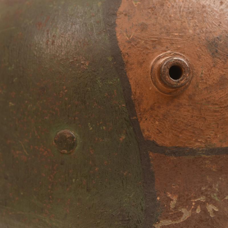 GERMAN WWI M.17 CAMOUFLAGE HELMET, COMPLETE WITH LINER AND THE RARE CHINSTRAP.