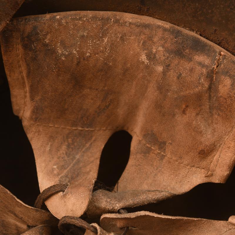 GERMAN WWI M.17 CAMOUFLAGE HELMET, COMPLETE WITH LINER AND THE RARE CHINSTRAP.