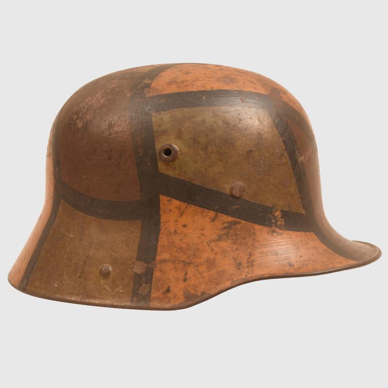 GERMAN WWI M.16 CAMOUFLAGE TRENCH HELMET WITH PARTIAL CHINSTRAP.