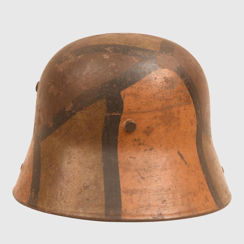 GERMAN WWI M.16 CAMOUFLAGE TRENCH HELMET WITH PARTIAL CHINSTRAP.