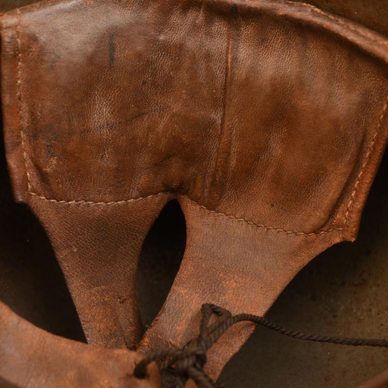 GERMAN WWI M.16 TRENCH HELMET WITH LINER AND ORIGINAL CHINSTRAP.