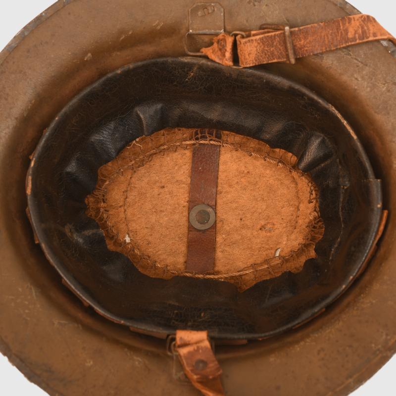 BRITISH WWI BRODIE COMBAT HELMET.