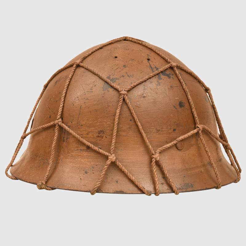 JAPANESE WWII TYPE 90 ARMY COMBAT HELMET WITH STRING NET.
