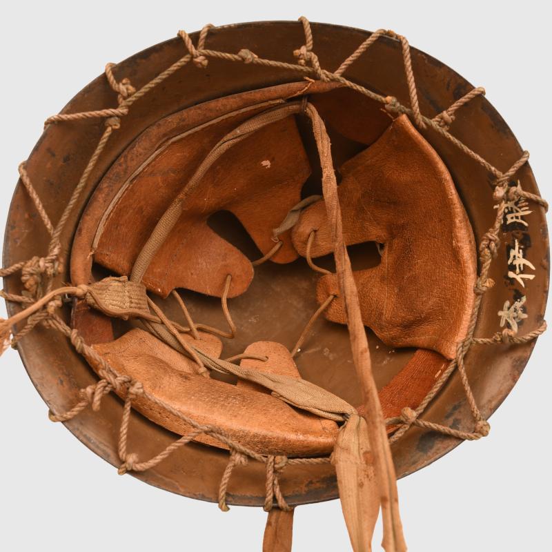 JAPANESE WWII TYPE 90 ARMY COMBAT HELMET WITH STRING NET.