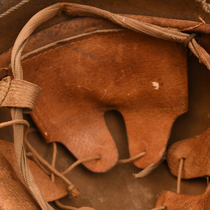 JAPANESE WWII TYPE 90 ARMY COMBAT HELMET WITH STRING NET.