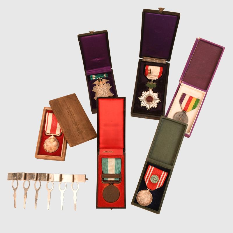 JAPANESE WWII FULL COLONEL’S TUNIC, TROUSERS, CAP AND AWARDS.